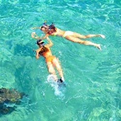 Two girls exploring the fascinating under water world of the Cretan Seas on their Snorkeling Excursion by Boat from Evelin Diving Center.