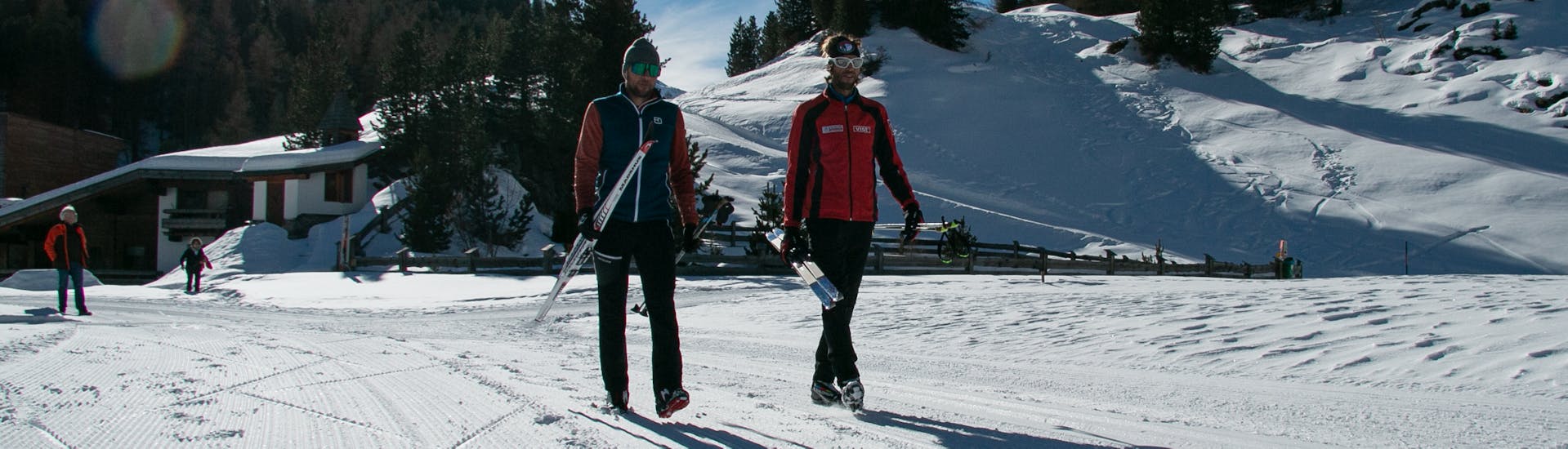 Two people skiing next to each other at Cross-Country Skiing Lessons for Beginners.