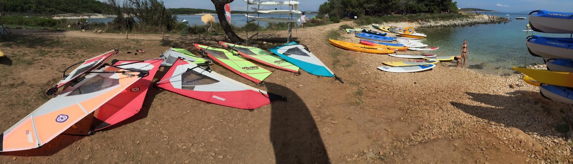 A group of boards from a Sit-On Sea Kayak Rental at Cape Kamenjak with Windsurf Station Premantura.