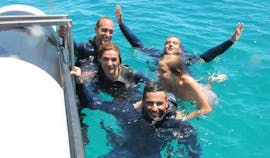 A family having fun in the water during the snorkeling excursion with Haliotis Santa Maria.