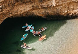 People doing the SUP Tour from Praia do Castelo to the Caves and Cliffs with Albufeira Surf & SUP.