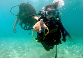A diver is doing an okay sign under the water during the Discover Scuba Diving in Lindos for Beginners with Lepia Dive Centre Rhodes.