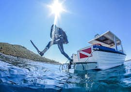 PADI/SSI Scuba Diver Course in Hvar for Beginners Cover A diver jumping into the blue waters of the sea during PADI/SSI Scuba Diver Course in Hvar for Beginners with Aqualis Dive Center Hvar.