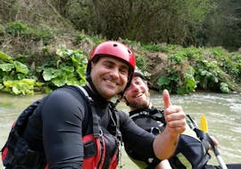 View of two people smiling in a raft boat during the Classic Rafting on the River Corno with Rafting Nomad.