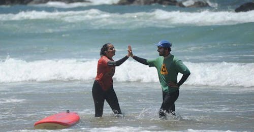 Private Surfing Lessons for Kids and Adults - All Levels with Amado Surf School Two happy surfers during a Private Surfing Lessons for Kids and Adults - All Levels with Amado Surf School.