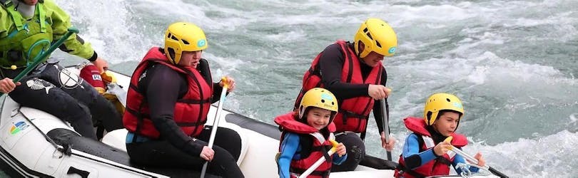 A family is taking part into the Rafting on the Doron de Bozel for Families with Evolution 2 Peisey Vallandry - H2o Sport.