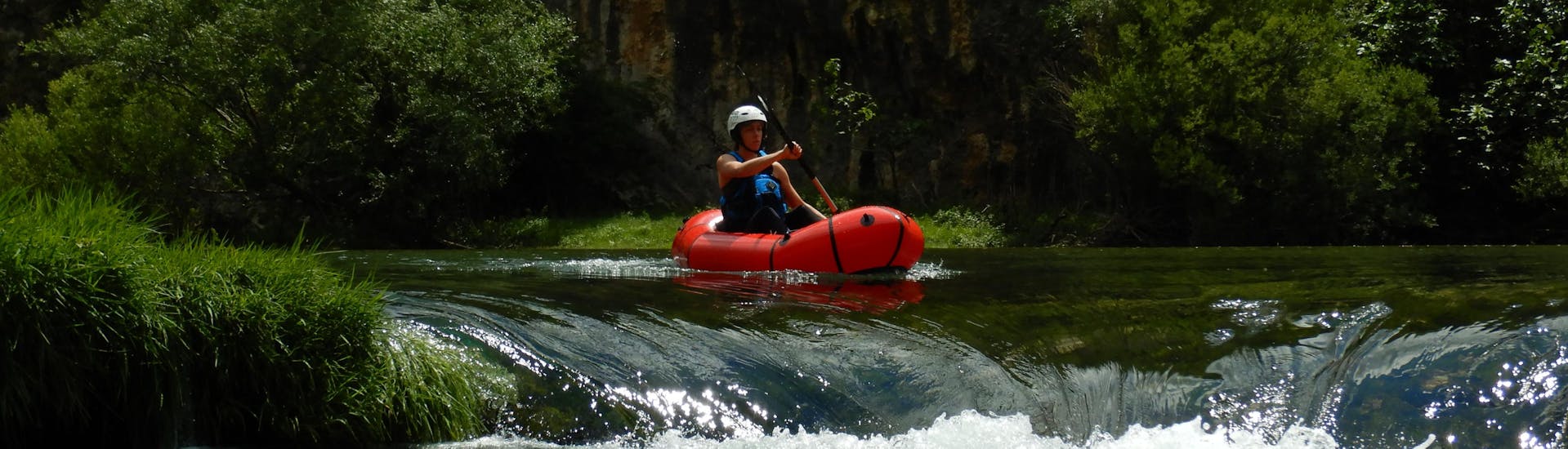 A person on a raft during the Packrafting on the Zrmanja & Krupa Rivers with Raftrek Adventure Travel Croatia.