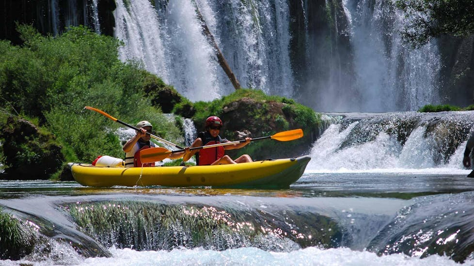 Two people on a kayak during the Classic Kayaking on the Zrmanja & Krupa Rivers with Raftrek Adventure Travel Croatia.