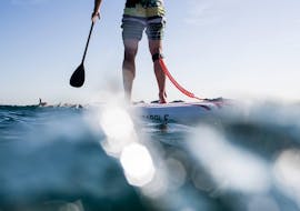 A participant paddle boarding in Barcelona with rental provided Moloka´i SUP Centerby 