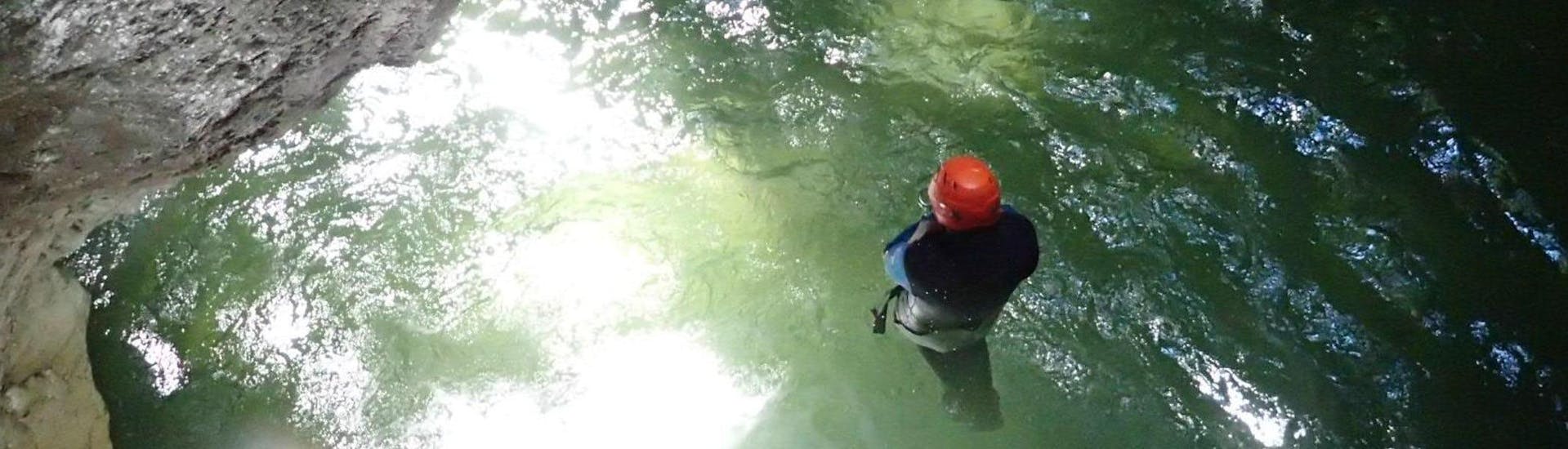 A man participating to Canyoning "Sensation" - Pont du Diable with Térreo Canyoning is discovering the cave.