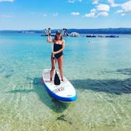 A women enjoying a day on the SUP, rented in Duće with Watersport Croatia.