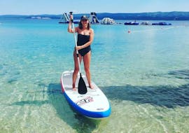 A women enjoying a day on the SUP, rented in Duće with Watersport Croatia.