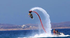 A person on a flyboard during flyboarding at Saint George Beach - with Flisvos Watersports 1974 Naxose.