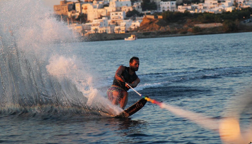 A person doing waterski during waterskiing at Saint George Beach - with Flisvos Watersports 1974 Naxos.