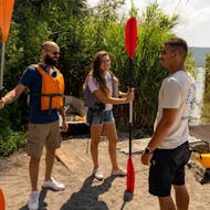 The instructor is talking with the participants before starting the Kayaking on Lake Albano in Castel Gandolfo with Canoa Kayak Academy - Castel Gandolfo.