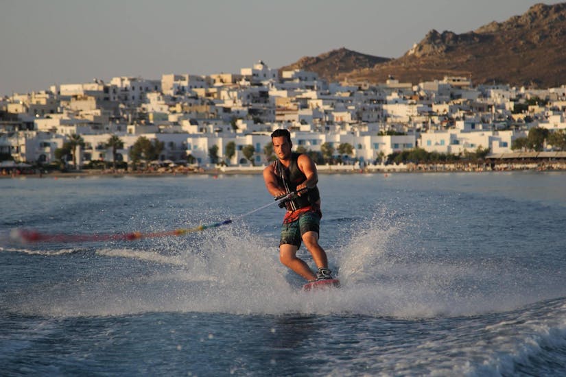 A man wakeboarding at Saint George Beach in Naxos with Flisvos Watersports 1974 Naxose.