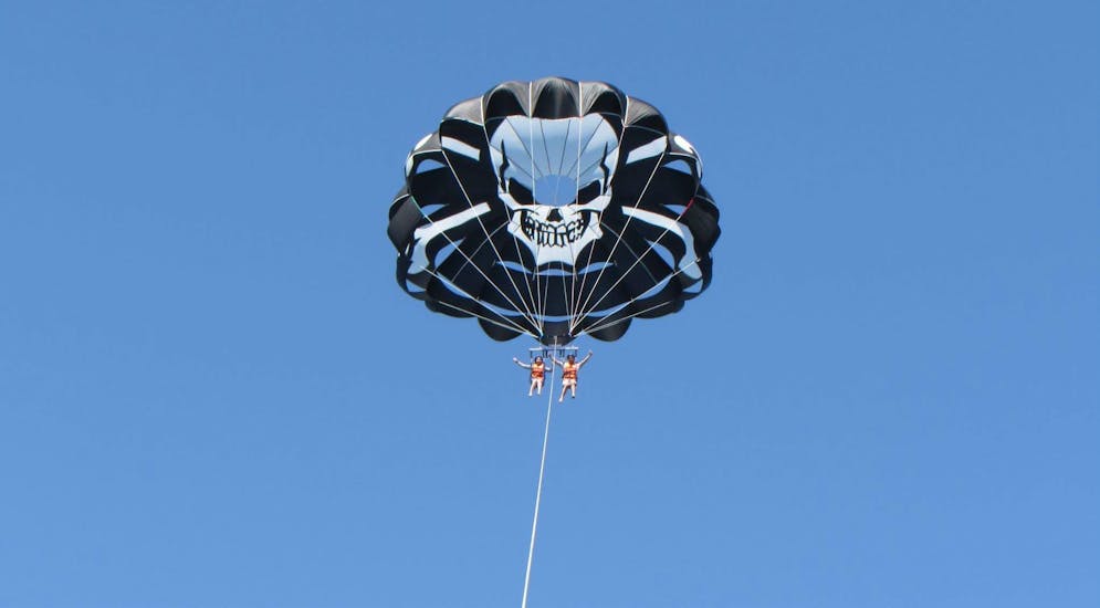 Photo of two people enjoying their Parasailing up to 400m in Fuengirola - Fly up to 3 together with Pirate Parasailing Fuengirola.