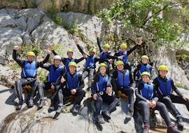 A group of people from Iris Adventure Dalmatia on a rock by the Cetina River.