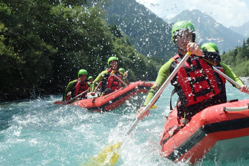 A couple of boats in the water during Adventurous Canoe Rafting on the Lech River with Outdoorzentrum Allgäu.