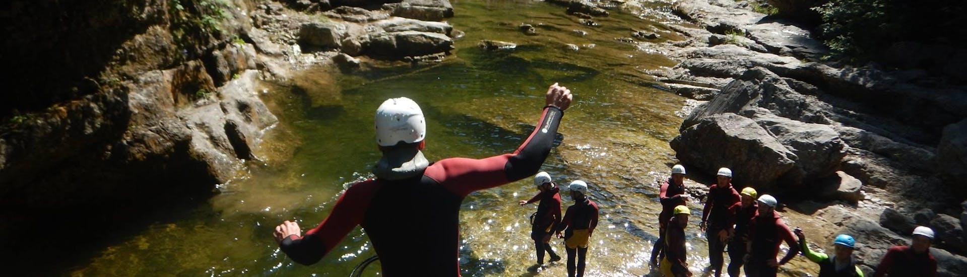Jumping down from a cliff during Canyoning near Hallein for Beginners - Jump'n Fun with myadventure Schladming.