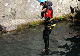 A canyoning enthusiast is jumping in a natural pool while doing a Canyoning "Classic" - Canyon Aéro Besorgues with Les Intraterrestres.