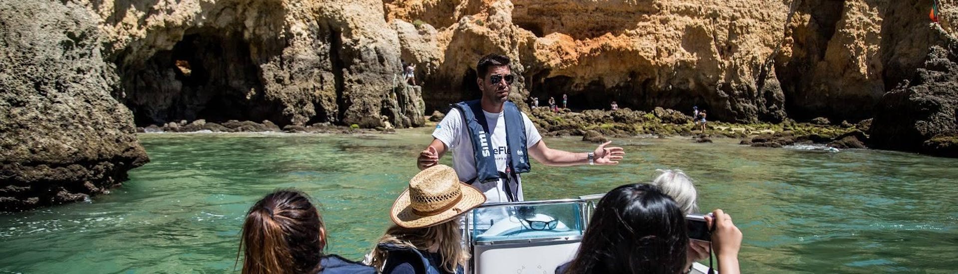 A guide and participants during a Boat Trip to Ponta Da Piedade from Lagos  with BlueFleet Lagos.