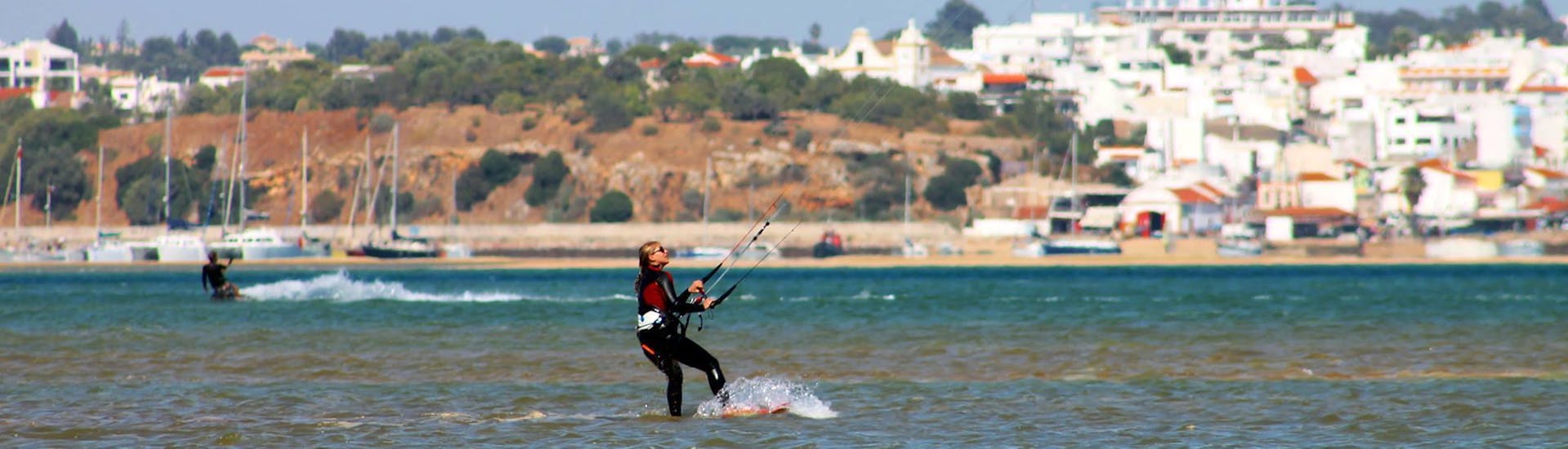 View from the cost of a guy kitesurfing during the Kitesurfing Lessons for Kids & Adults - All Levels.