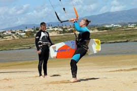 Our instructor is explaining the basis of kitesurfing during the Semiprivate Kitesurfing Lessons in Pairs - All Levels with KiteSchool.pt Lagos.