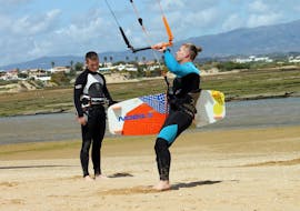Our instructor is explaining the basis of kitesurfing during the Semiprivate Kitesurfing Lessons in Pairs - All Levels with KiteSchool.pt Lagos.