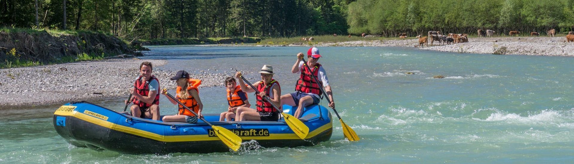 A family is paddling down the Loisach river during their Raft Rental in Farchant with Bavariaraft.