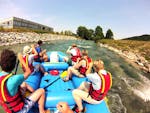 A group of friends is paddling down the Loisach river during their Raft Rental in Farchant with Bavariaraft.