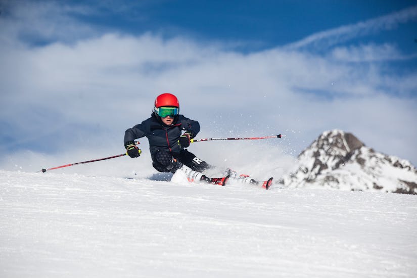 A group of kids enjoying their private ski lessons for kids & teens of all ages with Ski School Passion Ski - St. Moritz.