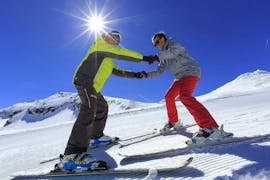 Group enjoying their Private Ski Lessons for Adults - Low Season - All Levels create perfect conditions for a beginner who is learning how to ski with an experienced ski instructor from the ski school Prosneige Val d'Isère.
