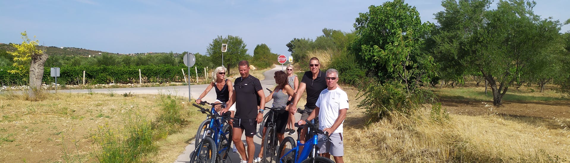 Participants of the difficult mountain bike tour to Krka National Park with Karika Vodice, pose for a picture during a break.