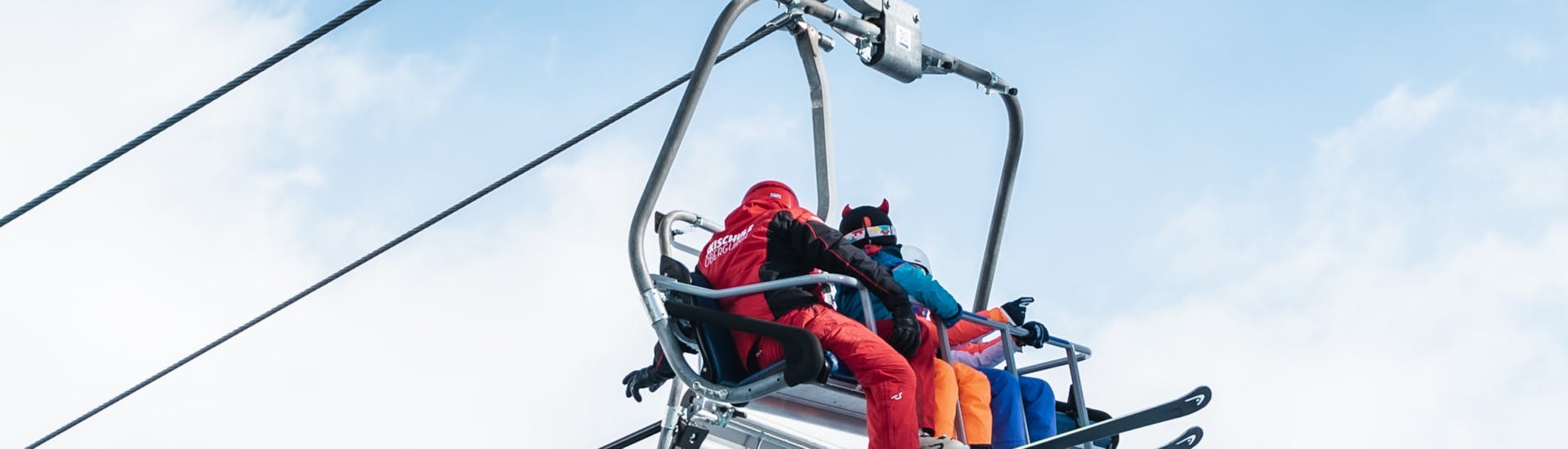 Skiers taking the cable car at Private Ski Lessons for Adults of All Levels.