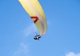 A participant enjoying a paragliding experience over Kravec Mpuntain during a tandem paragliding activity with Sky Riders Paragliding Croatia.