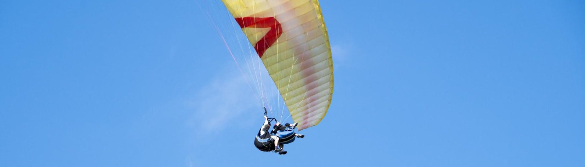 A participant enjoying a paragliding experience over Kravec Mountainduring a thermic tandem paragliding activity with Sky Riders Paragliding Croatia.
