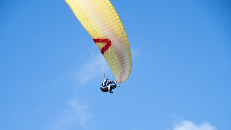 A participant enjoying a paragliding experience from Ivanscica Mountain during a thermic tandem paragliding activity with Sky Riders Paragliding Croatia.