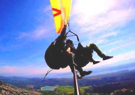 A participant enjoying a paragliding experience from Ivanscica Mountain during a thermic tandem paragliding activity with Sky Riders Paragliding Croatia.