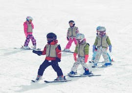 A group of children aged 4-6 enjoy a ski lesson at Baqueria with Mammut Ski School. 