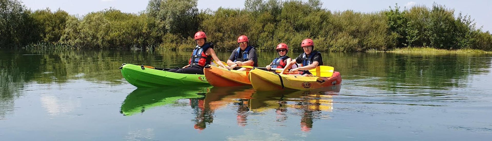 A group of friends is relaxing on Cetina River during the Kayak Safari "Cetina River" - Sinj organised by Hotel Alkar.