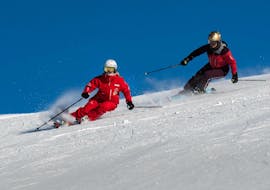 An adult skier follows his instructor during the private ski lessons for adults for all levels with the Grindelwald Ski School. 