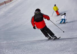 Participant following the ski instructor in Andalo during one of the Private Ski Lessons for Adults of All Levels.