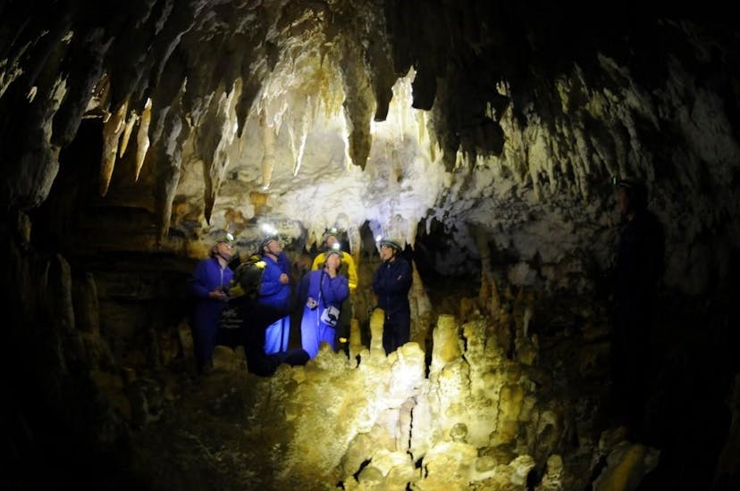 Participants in an activity of speleology in Cueva de Pando provided by Rana Sella Arriondas.