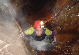 A participant in an activity of speleology in Cueva de Pando provided by Rana Sella Arriondas.