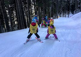 Kids attending their first ski course during one of the kids ski lessons for first timers in Cavalese.