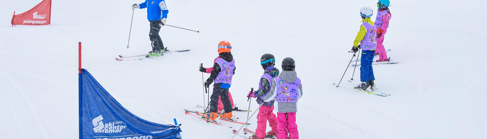 Kids Ski Lessons (4-6 y.) for Beginners with Scuola Italiana Sci e Snowboard Alpe di Pampeago - Hero image