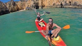 Two people are pn a kayak during the Sea Kayak Tour to the Ponta da Piedade Grottos with Discover Tours Lagos.
