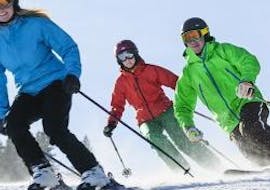 During the Adult Ski Lessons for First Timers - Half Day, a group of skiers is exploring the slopes of Feldberg together with their instructor from Schneesportschule Black Forest Magic Feldberg.