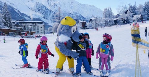 Kids Ski Lessons "Piou-Piou" (3-4 y.) in Chamonix from Ski School ESF Chamonix Young skiers are learning to ski with the mascot of the ski school ESF Chamonix during their Kids Ski Lessons "Club Piou-Piou" (3-4 years).